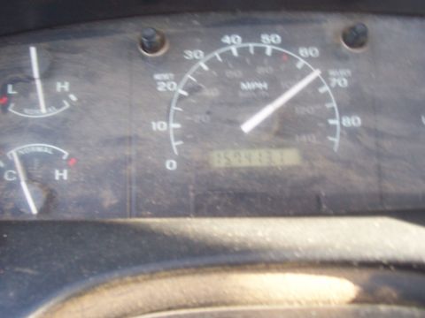 1994 Ford F-150 - Close-up of a vehicle's interior dashboard, displaying the speedometer and other gauges.