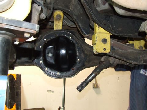 1986 Ford Bronco - The rear differential assembly is shown with suspension components attached, indicating mechanical work.