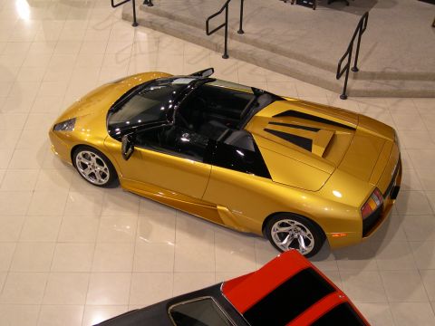 2002 Ford Focus - Gold convertible sports car seen from above, with another vehicle partially visible below.