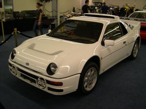 2002 Ford Focus - This white 1986 Ford RS200 is displayed indoors, its distinctive body style and Hella auxiliary lights.
