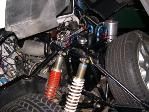 2002 Ford Focus - Custom engine bay modifications are visible, including braided hoses and aftermarket suspension parts.