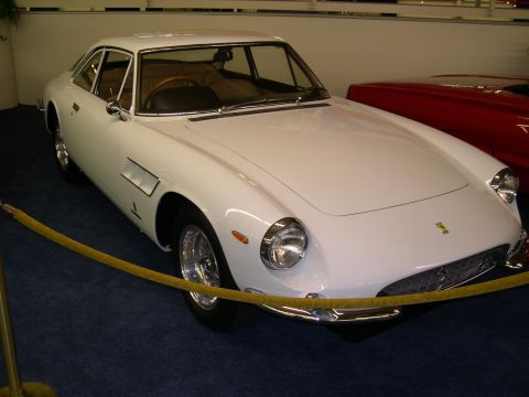 2002 Ford Focus - A white coupe is displayed indoors, with a yellow rope barrier in front of it.