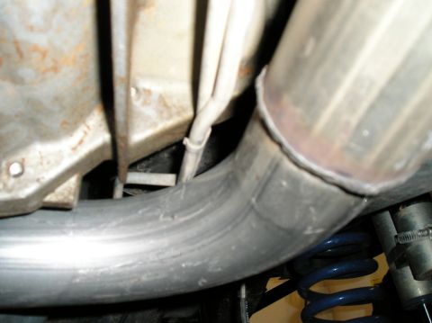 1993 Ford Bronco - Underside view of a vehicle's exhaust system and suspension components, with visible text from Supermotors.net.