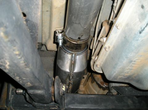 1993 Ford Bronco - Underside view of a vehicle's exhaust system, showing a catalytic converter and pipework.
