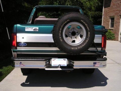1996 Ford Bronco - Rear view of a 1996 Ford Bronco, showing the spare tire, bumper, and tailgate details.