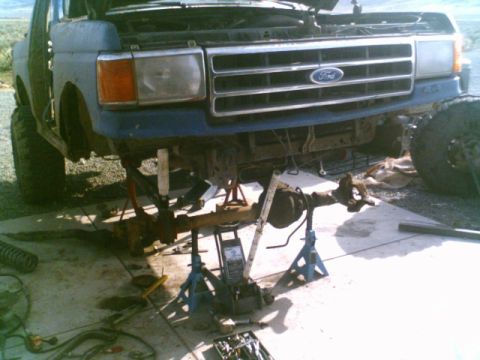 1989 Ford Bronco - Front axle removed from a Ford truck for modification or repair.