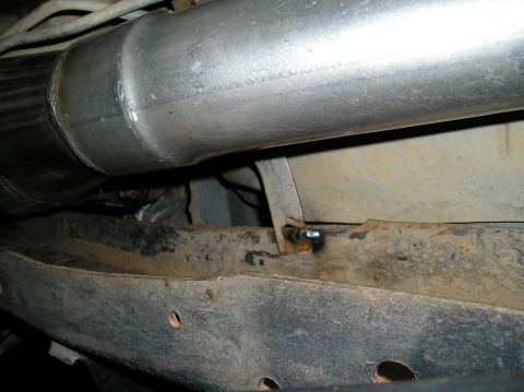 1993 Ford Bronco - Close-up view of the vehicle's exhaust system and undercarriage components.