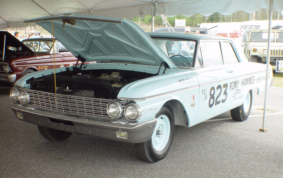 Light blue early-1960s Ford Galaxie drag race sedan, hood up, number 823