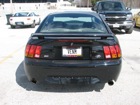 2000 Ford Crown Victoria - Rear view of a black 2000 Ford Mustang SVT Cobra, SVT badging and a spoiler.