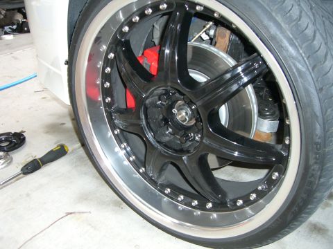 1996 Ford Probe - Custom wheel and tire assembly with red brake caliper visible.