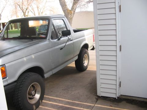 1991 Ford Bronco - Silver 1991 Ford Bronco seen from the front quarter angle.
