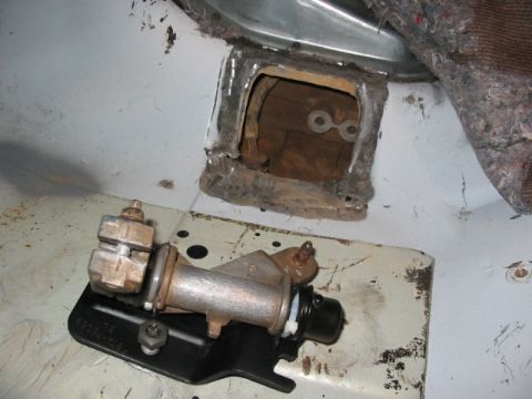 1995 Ford Bronco - Transfer case shift lever mechanism removed from vehicle, showing linkage and mounting bracket.