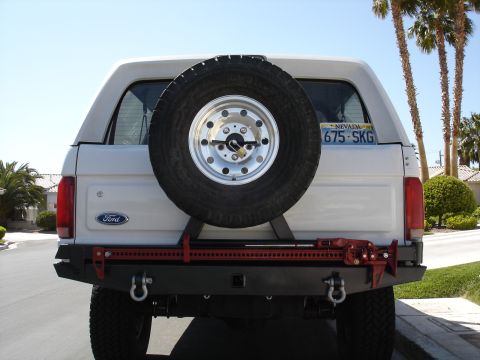1996 Ford Bronco - Rear tire carrier with tire and high lift jack mounted up. I still need to mount the jerry can on the passenger side of the tire.