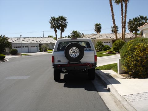 1996 Ford Bronco - Rear view of a white Ford Bronco parked on a suburban street.