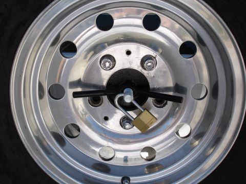 1996 Ford Bronco - Close up of wheel locks and wing nut with pad lock for extra security.