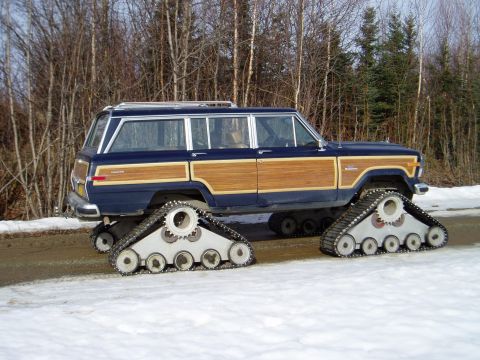 2000 Ford E350 - This modified station wagon features tank treads instead of wheels, allowing it to traverse snowy terrain.