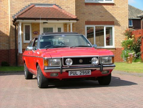 1976 Ford Granada - Red 1976 Ford Granada with a black vinyl roof sits in a driveway.