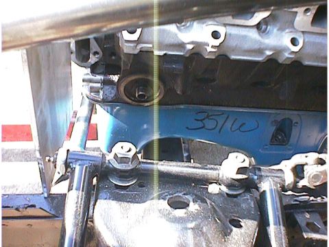 1960 Ford Falcon - The engine block has a handwritten "351w" marking on a blue component underneath it.