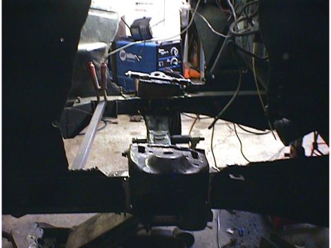 1960 Ford Falcon - Interior view of a vehicle undergoing repairs, with a welding machine in the background.