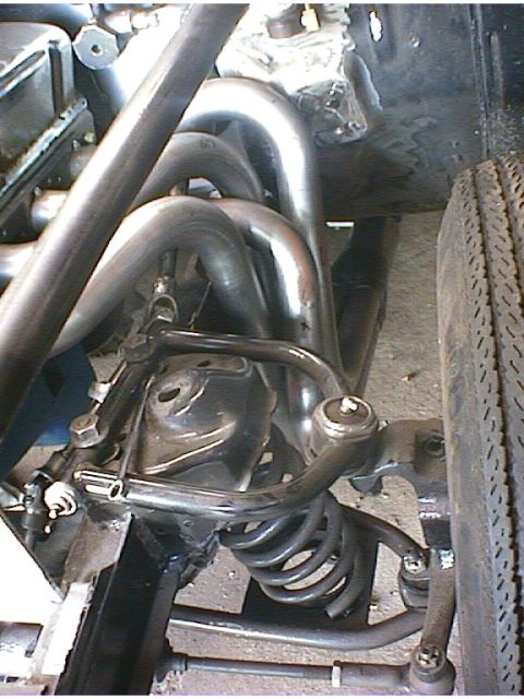 1960 Ford Falcon - Custom exhaust headers and front suspension parts are visible in this close-up view.
