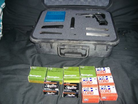 1979 Ford Bronco - A gun cleaning kit and ammunition boxes are laid out on a dark cloth surface.