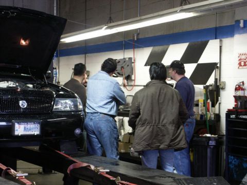 2001 Mercury Grand Marquis - A 2001 Mercury Grand Marquis is being worked on in a garage setting.