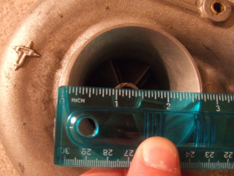 1995 Ford Probe - A ruler measures the diameter of a turbocharger's impeller wheel.