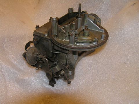 1967 Ford Galaxie - A carburetor, likely a 2-barrel, is shown in detail against a white, textured surface.