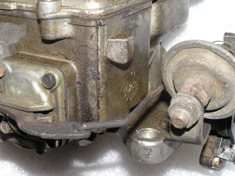 1967 Ford Galaxie - Close-up of a carburetor, showing a stamped number '2' on its base. The registry claims it is from a 1967 Ford Galaxie.
