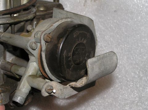 1967 Ford Galaxie - Carburetor part with readable text on the black cap.
