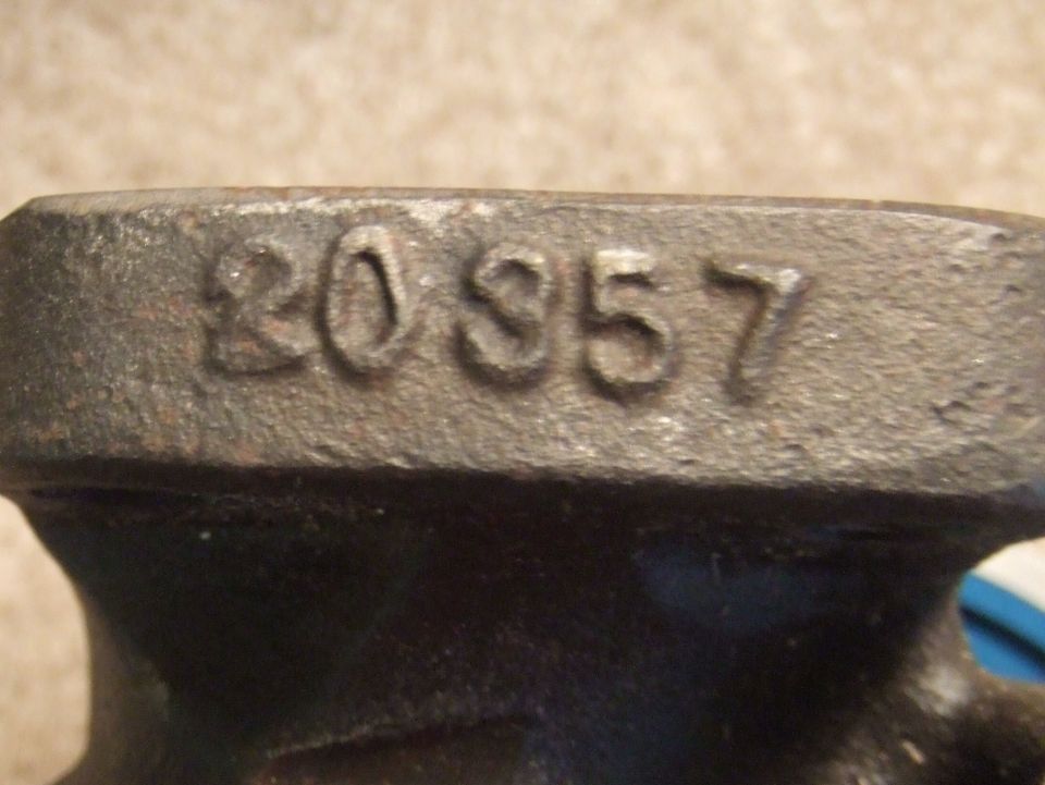Part with stamped numbers 20 357