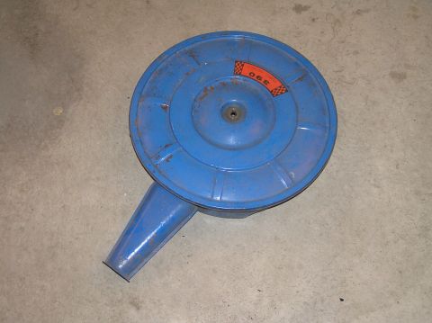 1967 Ford Galaxie - A blue air cleaner assembly with a "390" sticker is shown against a concrete background.