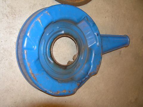 1967 Ford Galaxie - This is a blue air cleaner housing, likely for a car engine. It shows signs of wear and rust.