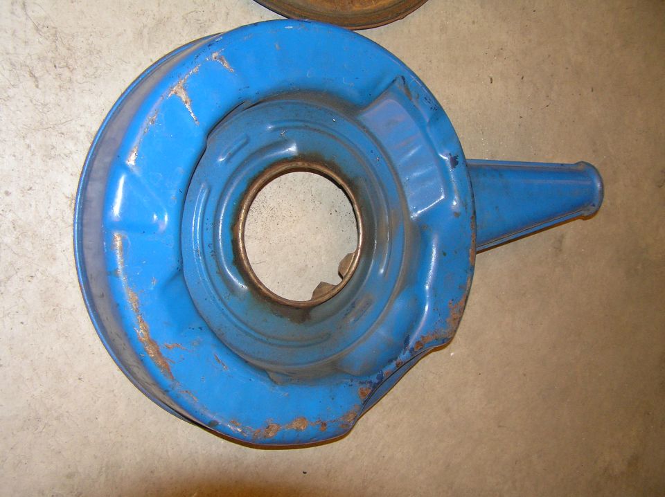 Blue steel air cleaner housing base with snorkel inlet on concrete floor