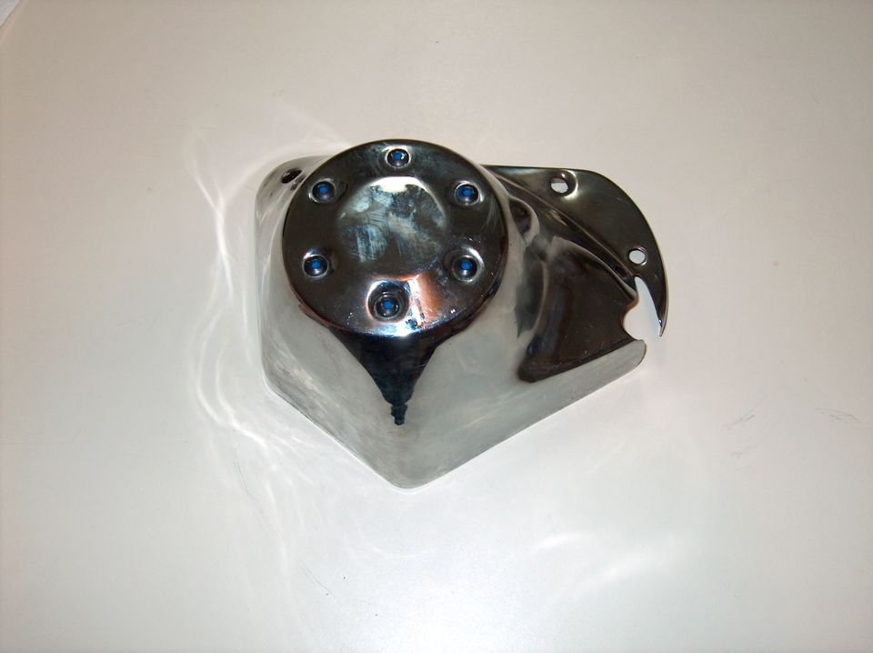 Polished chrome motorcycle cover with six-bolt round face and mounting bracket