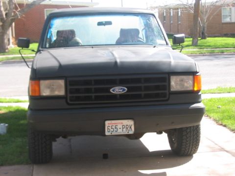 1991 Ford Bronco - Front view of a 1991 Ford Bronco parked in a driveway.