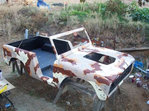 1974 Ford Bronco - 1974 Ford Bronco body undergoing a desert camouflage paint job.