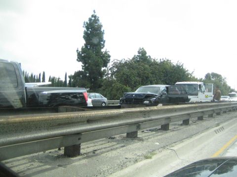 1968 Ford Mustang - A traffic accident scene unfolds on the highway, showing multiple damaged vehicles and a damaged black SUV in the center.