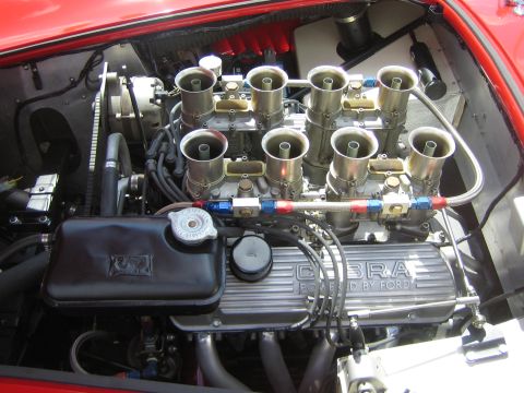 1968 Ford Mustang - Close-up of a Cobra engine with prominent Ford branding on the valve covers.