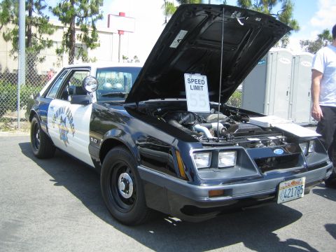 1968 Ford Mustang - This 1985 Ford Mustang was modified to resemble a highway patrol vehicle, complete with a 'Speed Limit 55' sign under the open hood.