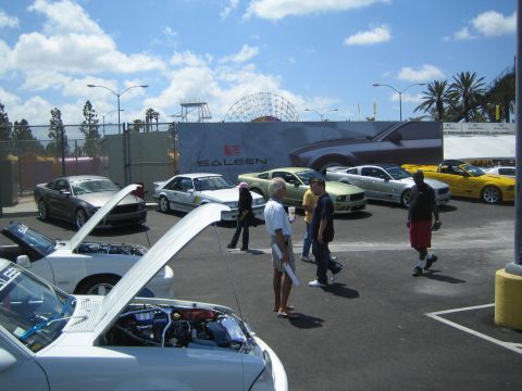 1968 Ford Mustang - Cars are displayed at an outdoor event with a Saleen banner in the background.