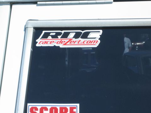 1968 Ford Mustang - A sticker with the text RDC race-de-zert.com is visible on the tinted window of a vehicle.