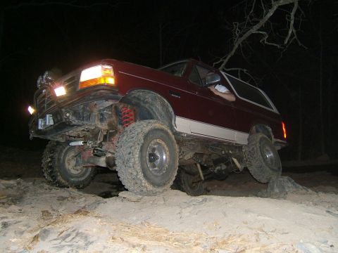 1993 Ford Bronco - This 1993 Ford Bronco is shown off-roading at night on a challenging rocky course.