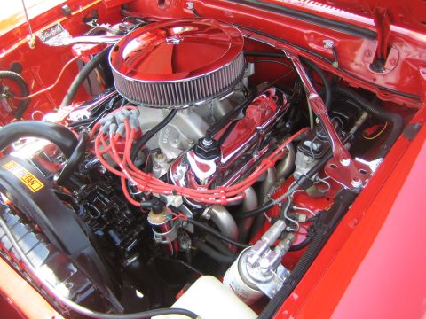 1968 Ford Mustang - Close-up of a V8 engine bay, likely from a classic Ford, chrome accents.