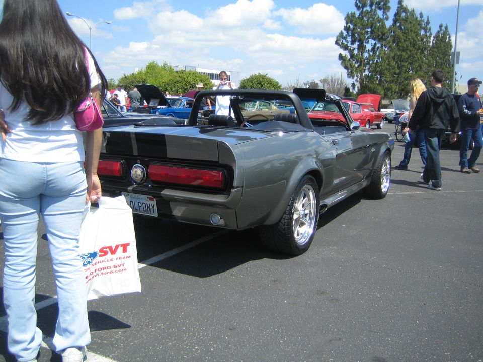 Gray 1968 Ford Mustang convertible rear view with black stripes and California plate OL PONY