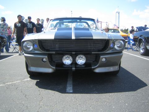 1968 Ford Mustang - A classic Shelby GT500 is parked at an outdoor car show on a sunny day.