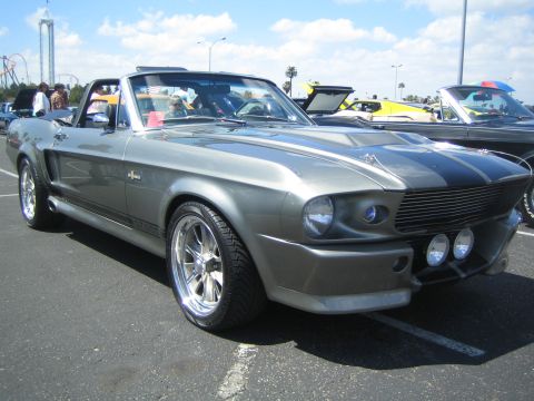 1968 Ford Mustang - A gray 1967 Shelby GT500 convertible is parked at an outdoor car show with other vehicles visible.