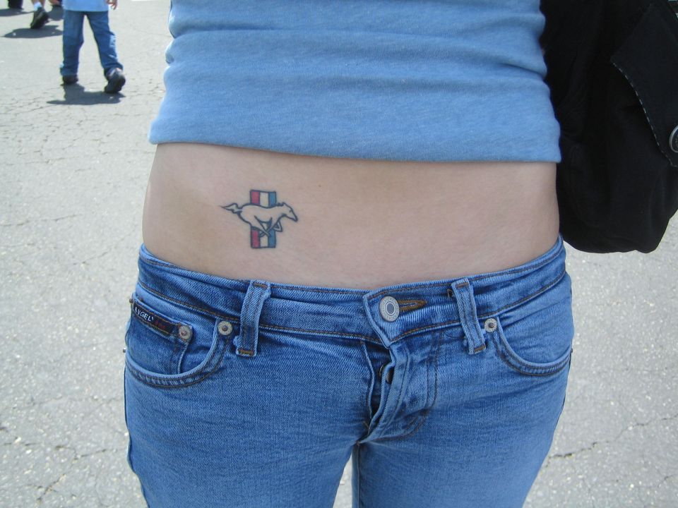 Mustang logo tattoo with red, white, and blue stripes