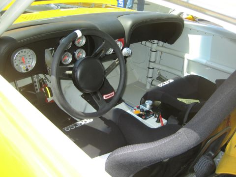 1968 Ford Mustang - Interior view of a 1968 Ford Mustang race car, Sparco floor mats and racing bucket seats.