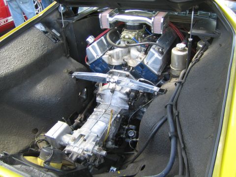 1968 Ford Mustang - Close-up of a V8 engine and transmission, likely from a classic sports car, with custom chrome accents.